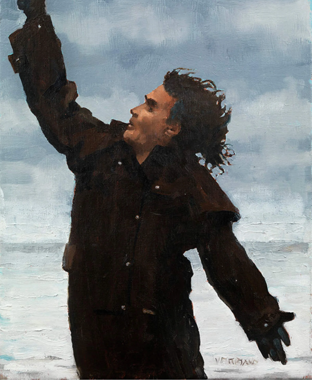 Billy Connolly with dark curly hair, wearing a dark brown jacket and gloves, looking upward with one arm raised against a cloudy blue-gray sky background.